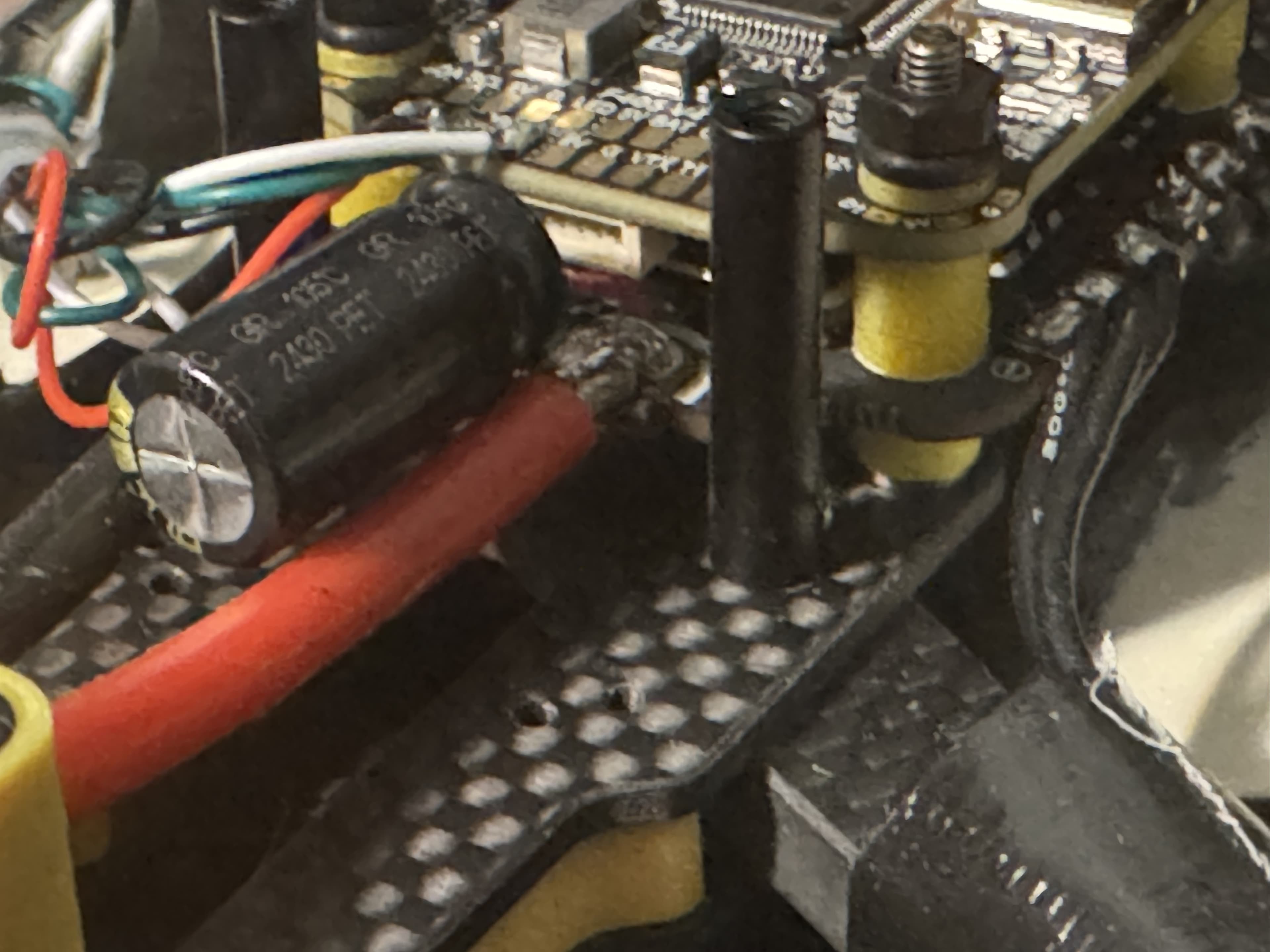 Side view of the SpeedyBee flight controller and ESC stack